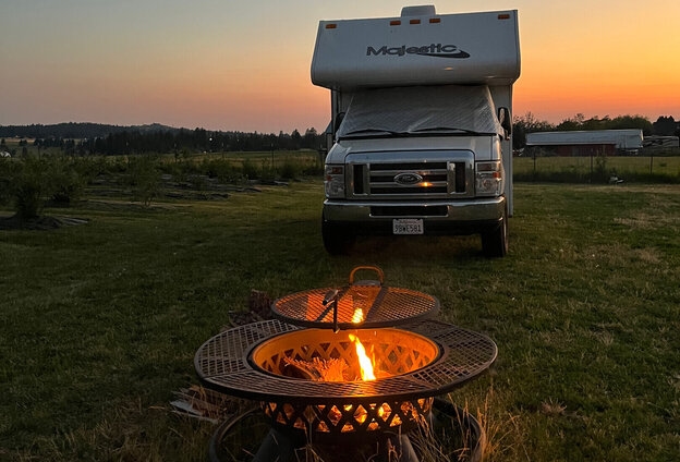 Image of a cozy fire pit setup at a Harvest Hosts location